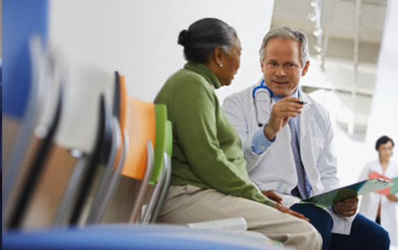 Doctor discussing something with patient